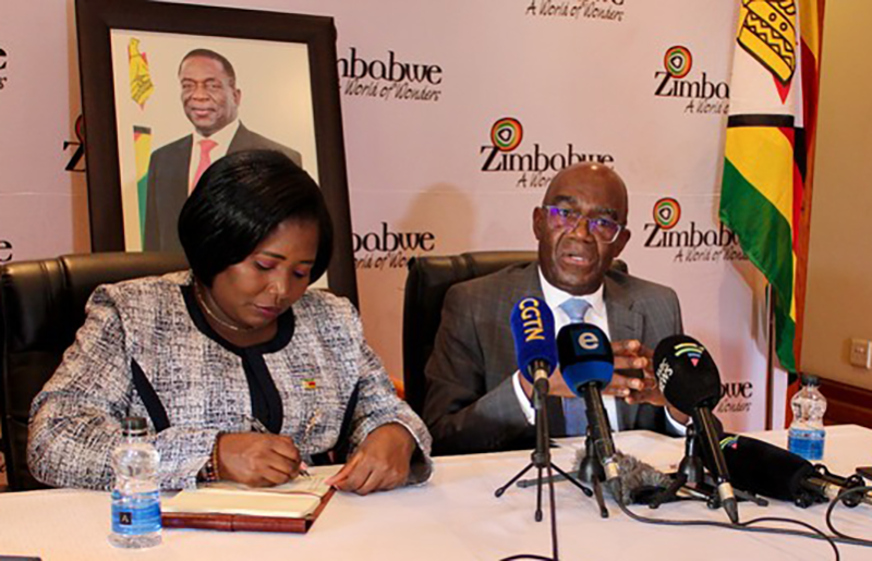 Zimbabwean Ambassador David Hamadziripi (right) says 60 e-passports issued daily since 21 June