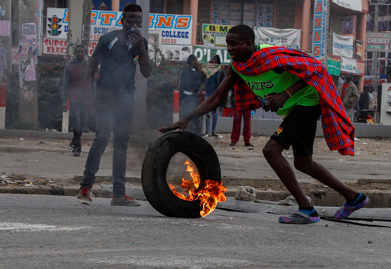 A protestor reacts during an anti-government demonstration following nationwide deadly riots over tax hikes and a controversial now-withdrawn finance bill