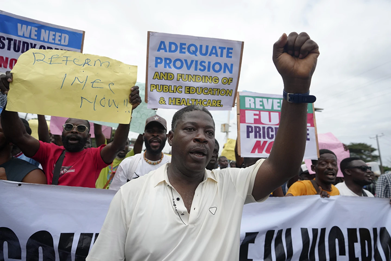 Rights group says security forces have killed 9 as Nigeria protests over hardship enter a second day