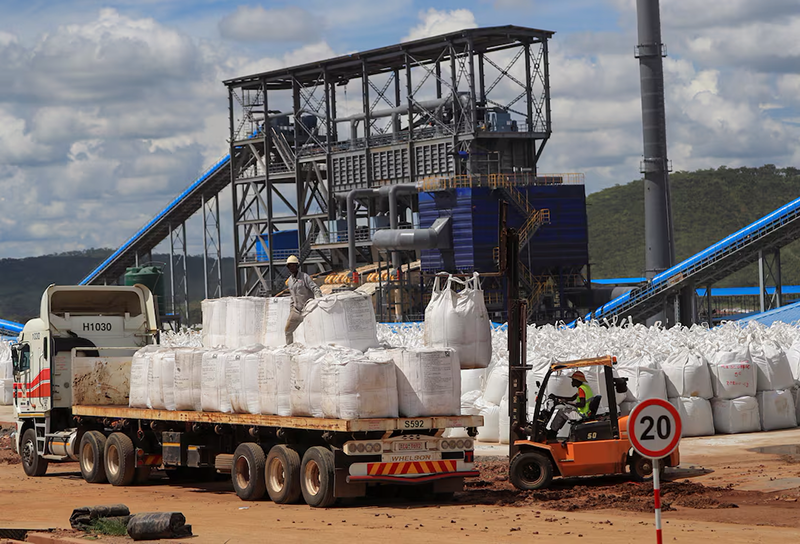 Workers load lithium concentrate at Prospect Lithium Zimbabwe mine in Goromonzi, Zimbabwe