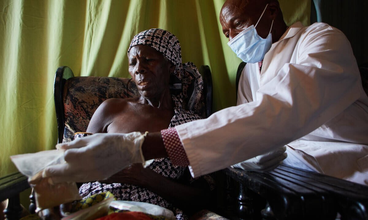 Agnes Kativhu, 67, has a consultation with herbalist Never Chirimo at his clinic in Harare