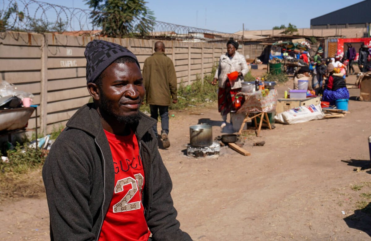 Tobacco farmer Peter Neshumba waits for payment after selling his crop to Premium Leaf Zimbabwe in Harare. He says contract farming controls nearly every aspect of production, leaving farmers with little say over their land until harvest.