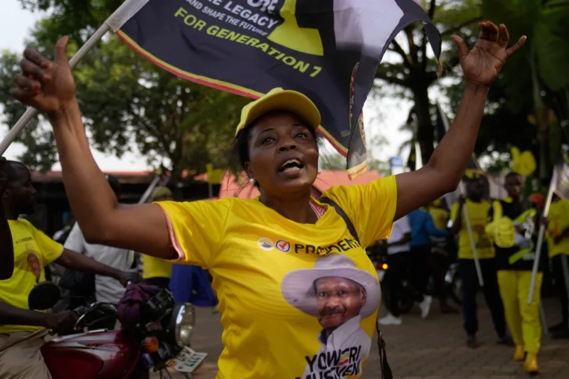 A woman celebrates Ugandan President Yoweri Museveni’s victory in the presidential election in Kampala, Uganda